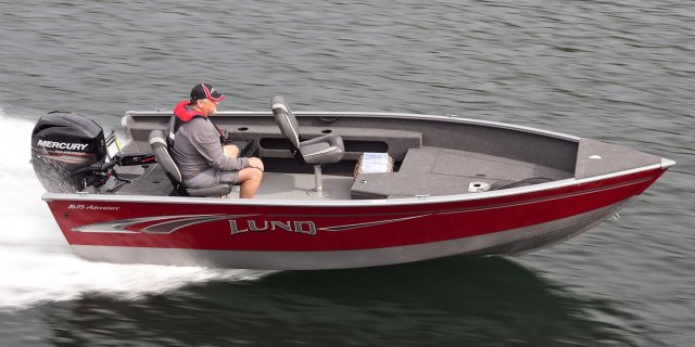 a seasoned fisher heads along Gordon Bay in his Lund 1675 Adventure tiller aluminum boat.