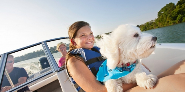 Young girl and dog in Bayliner 160 in Muskoka Ontario near Toronto