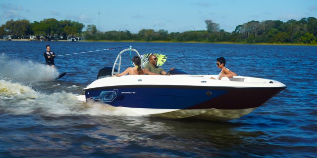 A man water skiing in their Bayliner Element E18 in Muskoka near Toronto Ontario