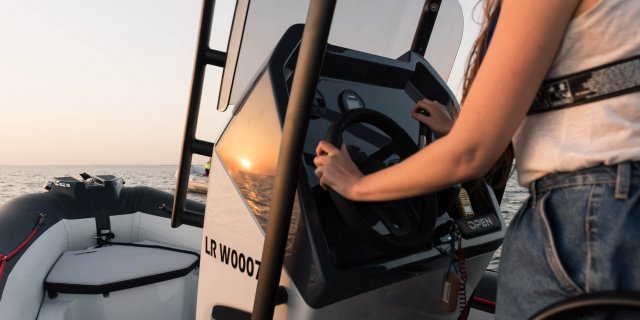 a woman steering her zodiac open 5.5 from gordon bay marine